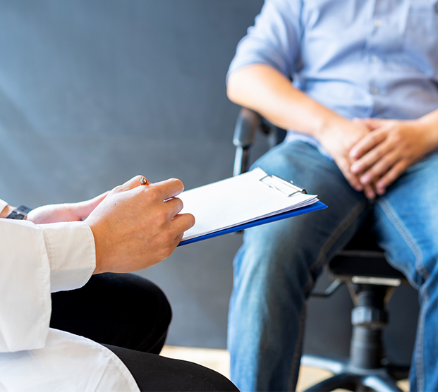 Physician evaluating patient with scrotal pain