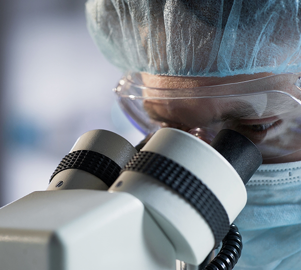 surgeon performing microscopic surgery