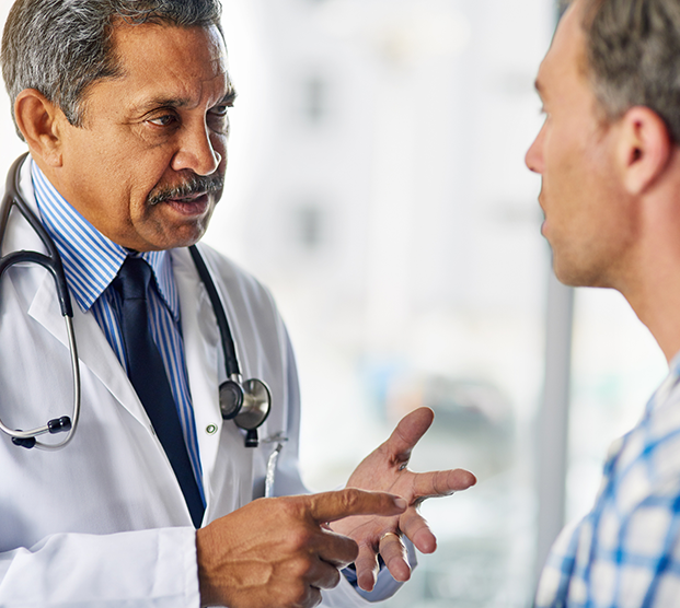 Doctor speaking to patient about causes of ejaculatory dysfunction