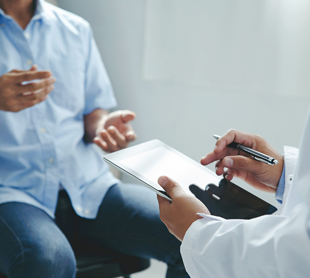 Physician describing treatment options for erectile dysfunction